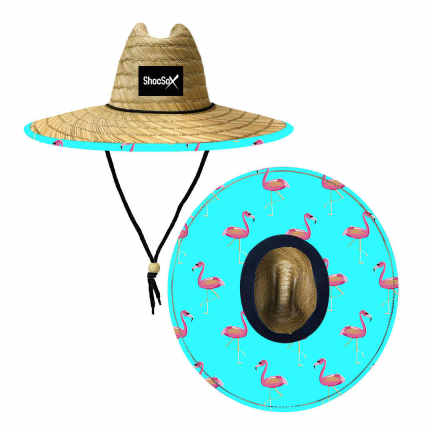 A beach straw hat with a wide brim featuring a ShosSox designed sewn patch front and center, with a drawcord and lock for tightening. The hat's crown liner is applied for additional sun protection, and it appears to be natural straw with a patterned underbrim.