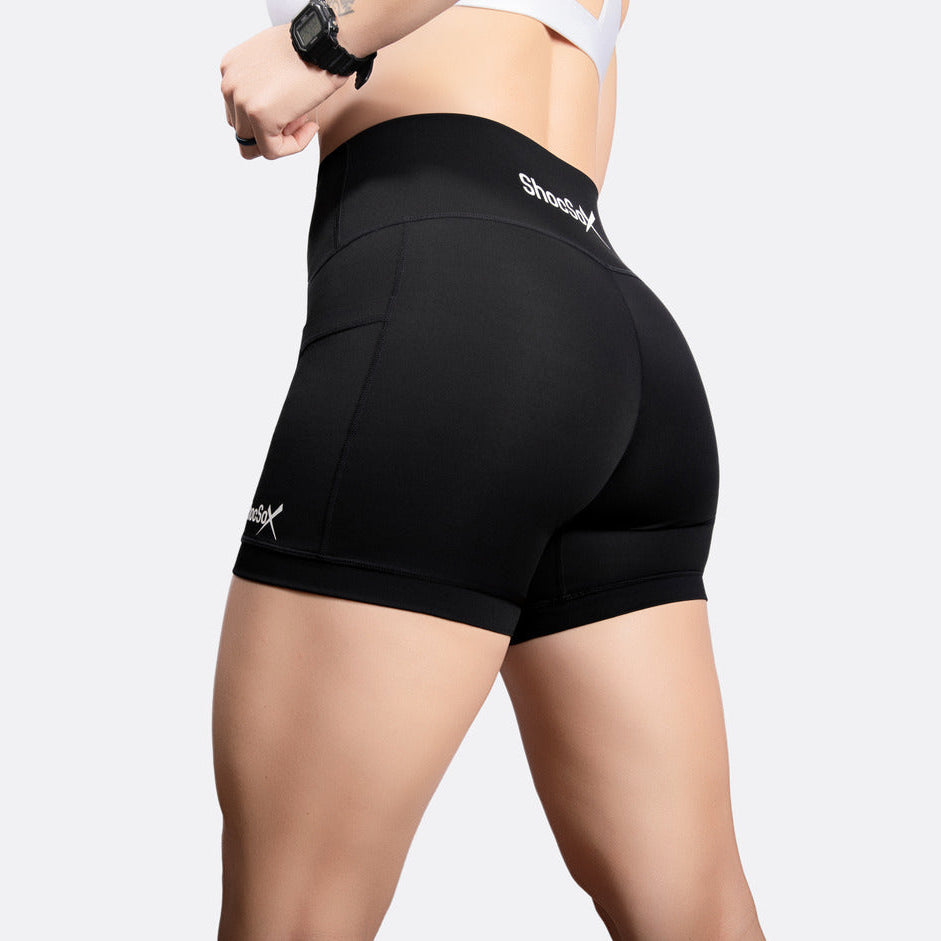 Black athletic shorts with a brand logo on a white background